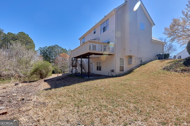 1484 Highland Bluff Ct, Suwanee, GA 30024 - back of house with a chimney, stairs, a wooden deck, a lawn, and a patio area