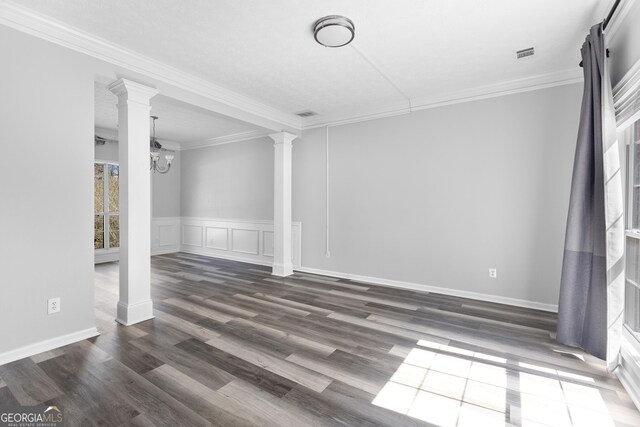 1484 Highland Bluff Ct, Suwanee, GA 30024 - unfurnished room featuring wood finished floors, a decorative wall, visible vents, ornamental molding, and ornate columns