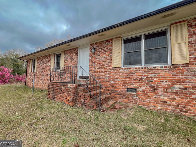 1105 Claxton Dairy Rd, Dublin, GA 31021 - view of front of home with a front lawn, crawl space, and brick siding