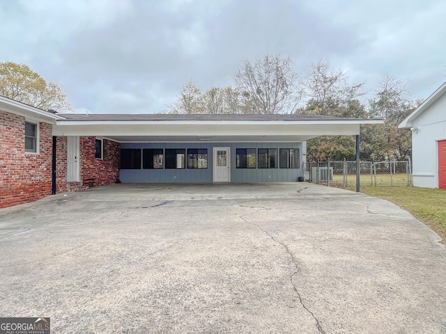 1105 Claxton Dairy Rd, Dublin, GA 31021 - exterior space featuring concrete driveway, a carport, and brick siding