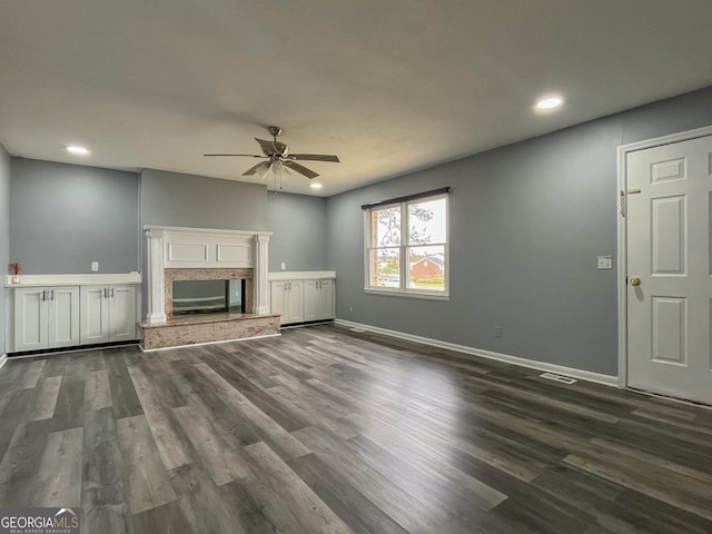 1105 Claxton Dairy Rd, Dublin, GA 31021 - unfurnished living room with ceiling fan, dark wood-style flooring, recessed lighting, and baseboards