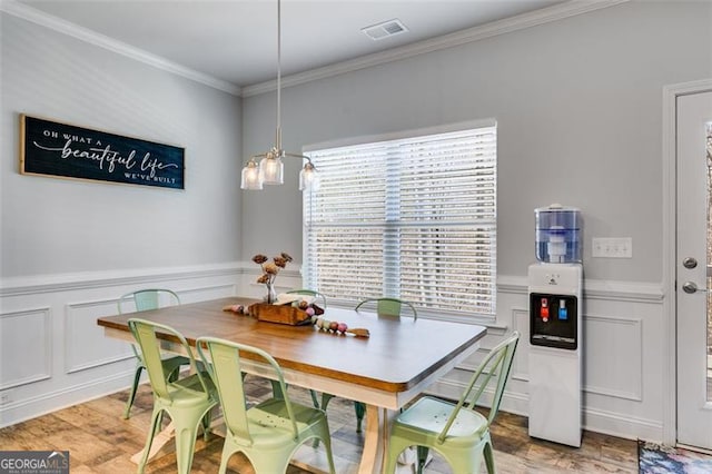 197 Saddleridge Dr, Bremen, GA 30110 - dining space with a decorative wall, plenty of natural light, ornamental molding, and wainscoting