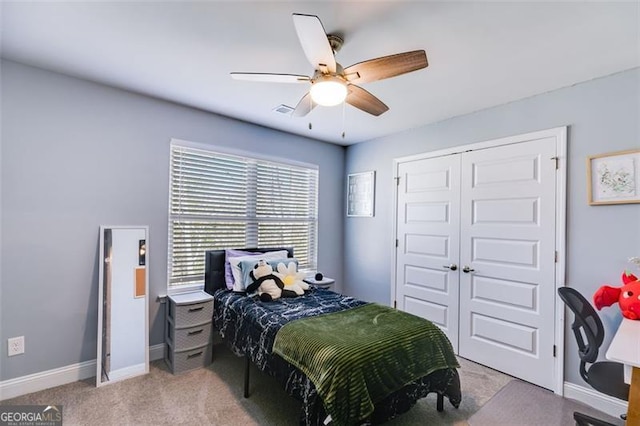 197 Saddleridge Dr, Bremen, GA 30110 - bedroom with light colored carpet, a closet, and a ceiling fan