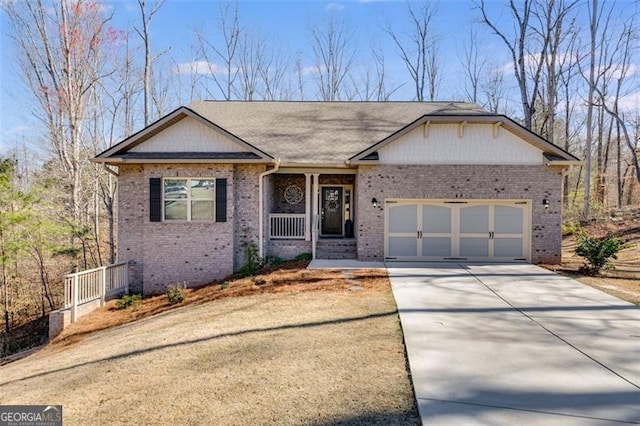 197 Saddleridge Dr, Bremen, GA 30110 - ranch-style house featuring brick siding, concrete driveway, a garage, and a porch