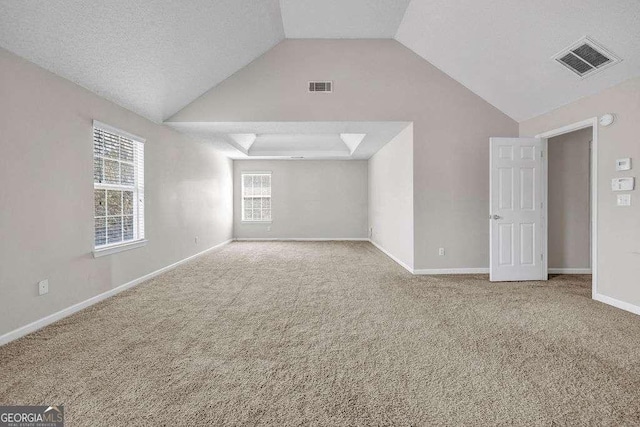 4970 Wewatta St SW, Atlanta, GA 30331 - spare room featuring carpet flooring and lofted ceiling