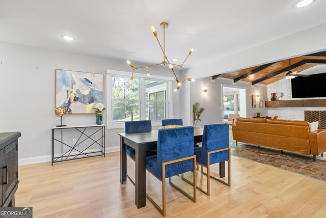 dining area featuring recessed lighting, light wood finished floors, an inviting chandelier, beamed ceiling, and baseboards