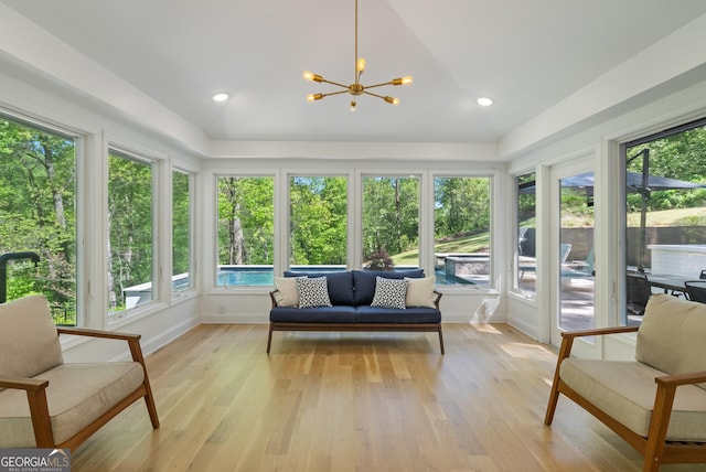 2672 Langland Ct NE, Atlanta, GA 30345 - sunroom featuring a chandelier, wood finished floors, baseboards, and vaulted ceiling