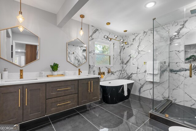 bathroom featuring a soaking tub, a marble finish shower, a sink, double vanity, and marble finish floor