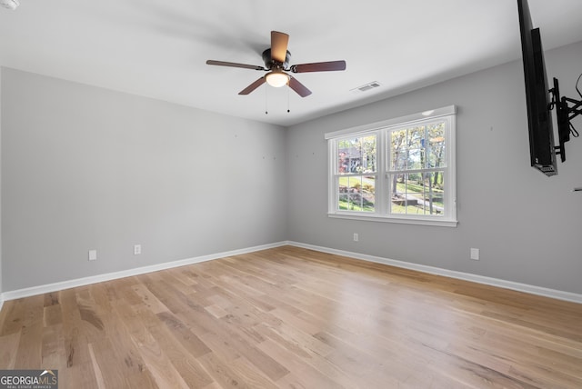 2672 Langland Ct NE, Atlanta, GA 30345 - empty room with ceiling fan, light wood finished floors, and baseboards
