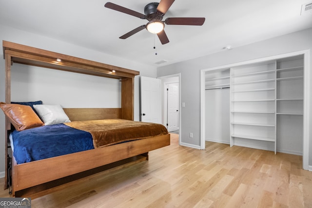 2672 Langland Ct NE, Atlanta, GA 30345 - bedroom with wood finished floors, baseboards, and a ceiling fan