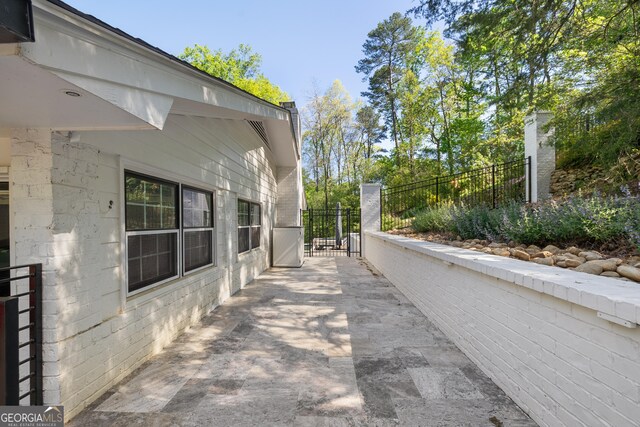 view of property exterior featuring fence