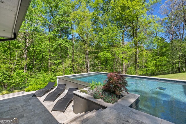pool with a patio area