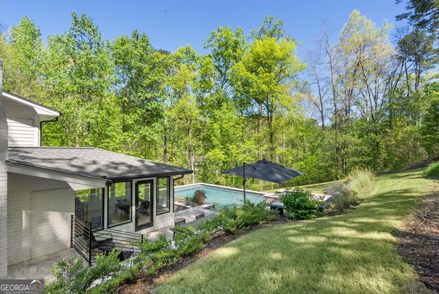 outdoor pool with a lawn