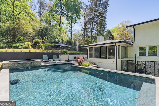 2672 Langland Ct NE, Atlanta, GA 30345 - view of swimming pool with a sunroom, an in-ground hot tub, and a patio