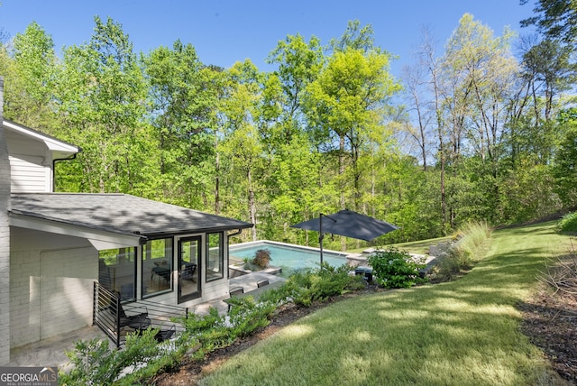 2672 Langland Ct NE, Atlanta, GA 30345 - view of grassy yard with an outdoor pool