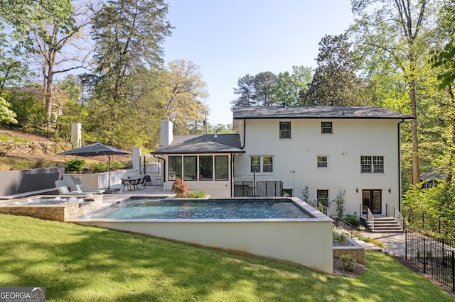 2672 Langland Ct NE, Atlanta, GA 30345 - back of house featuring a chimney, a patio area, and a sunroom