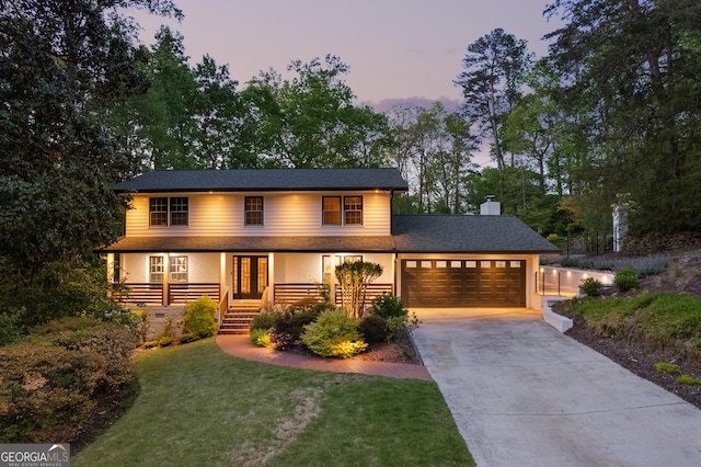 2672 Langland Ct NE, Atlanta, GA 30345 - view of front facade with a garage, driveway, a front yard, french doors, and a chimney