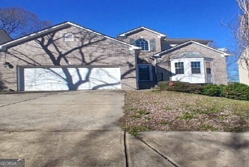 5522 Village Trce, Union City, GA 30291 - view of front of home featuring a garage and driveway