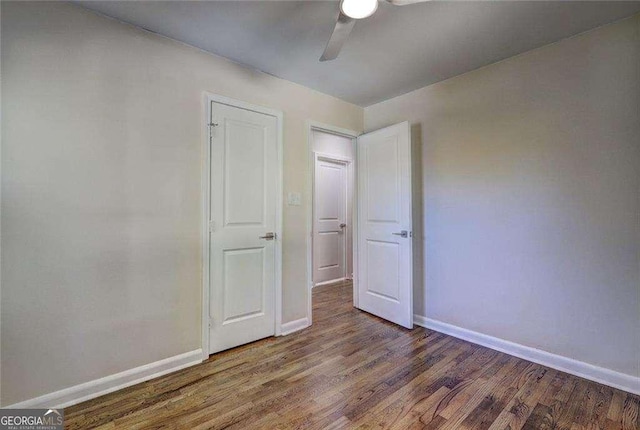 810 Commodore Dr NW, Atlanta, GA 30318 - spare room with baseboards, a ceiling fan, and wood finished floors