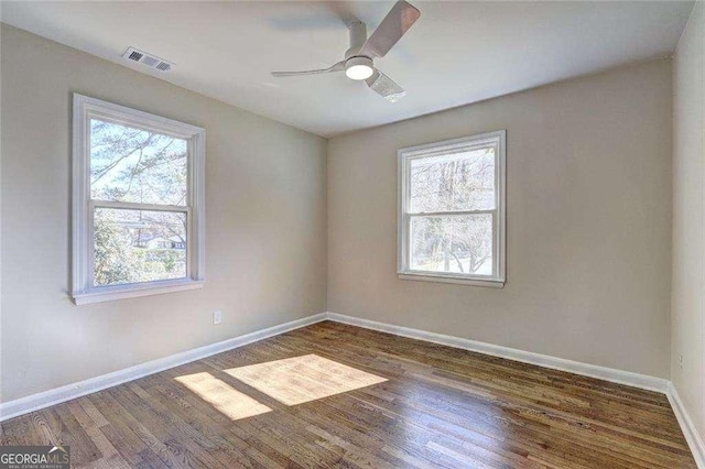 810 Commodore Dr NW, Atlanta, GA 30318 - empty room with wood finished floors, baseboards, and ceiling fan