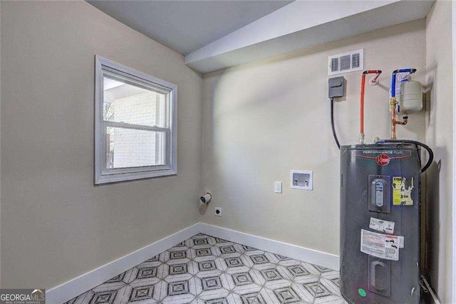 810 Commodore Dr NW, Atlanta, GA 30318 - laundry room featuring water heater, hookup for a washing machine, baseboards, and light floors
