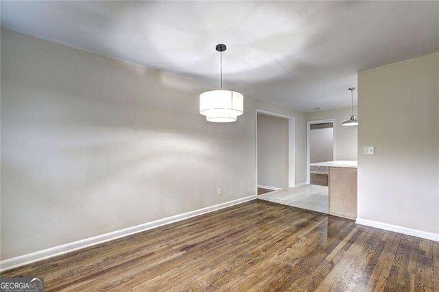 810 Commodore Dr NW, Atlanta, GA 30318 - spare room with wood finished floors and baseboards
