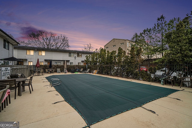 3501 Roswell Rd NE Unit 211, Atlanta, GA 30305 - pool at dusk featuring a patio area