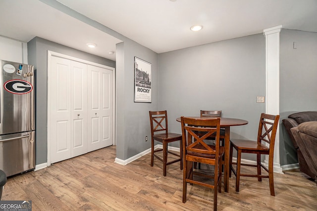 3501 Roswell Rd NE Unit 211, Atlanta, GA 30305 - dining room featuring baseboards, wood finished floors, and recessed lighting