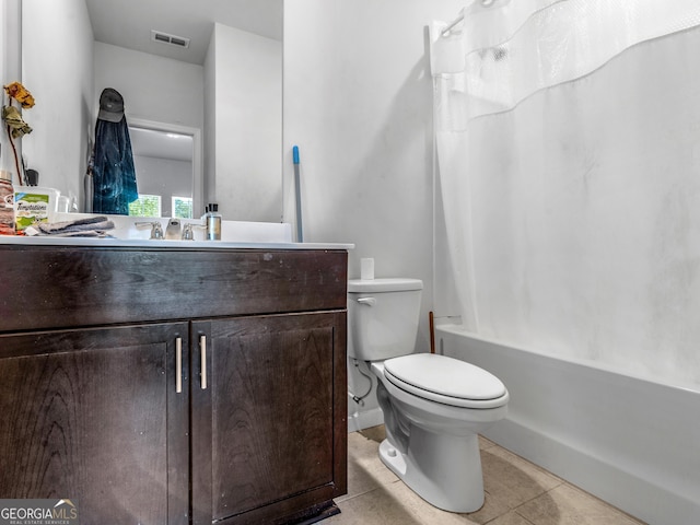 full bathroom with tile patterned flooring, vanity, toilet, visible vents, and shower / bath combination with curtain