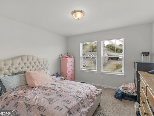 carpeted bedroom with baseboards