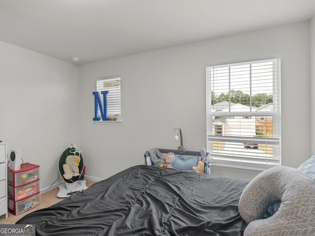 carpeted bedroom with baseboards