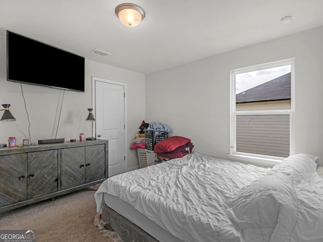 carpeted bedroom with visible vents