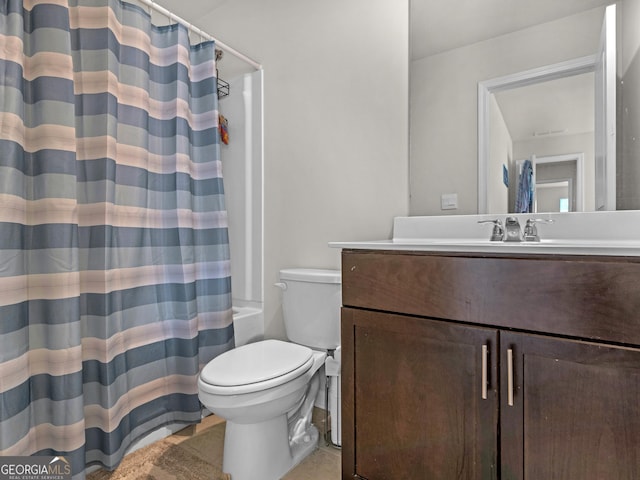 bathroom with toilet, shower / tub combo, and vanity