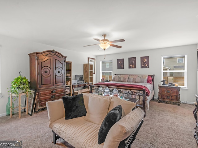 bedroom with light carpet, baseboards, and multiple windows