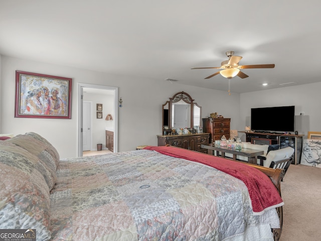 carpeted bedroom with visible vents and a ceiling fan