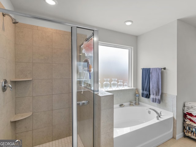 full bathroom with a shower stall, recessed lighting, and a garden tub