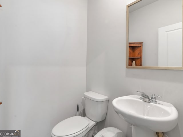 bathroom with a sink and toilet
