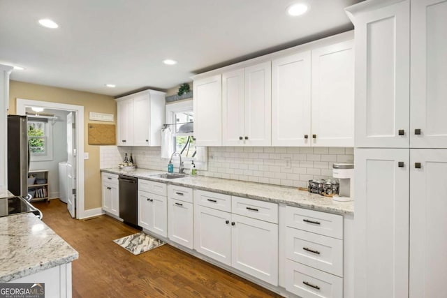 kitchen with dishwasher, white cabinets, a sink, and a healthy amount of sunlight