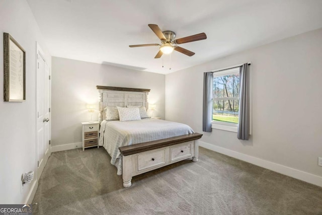 bedroom with light carpet, baseboards, and a ceiling fan