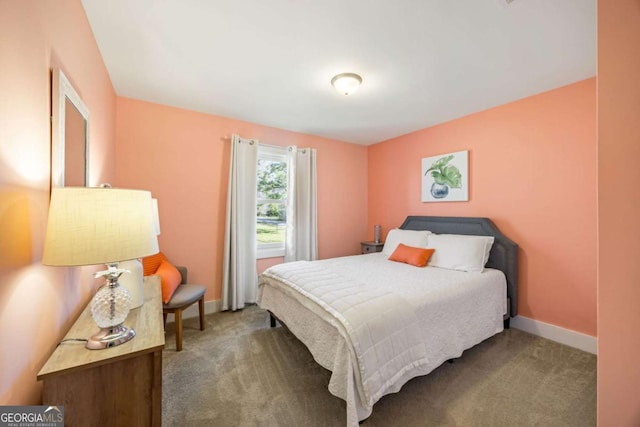 carpeted bedroom featuring baseboards