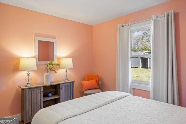 bedroom featuring multiple windows