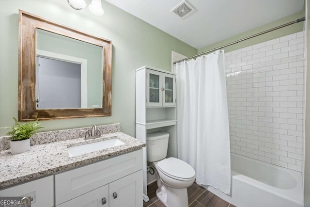 full bath featuring toilet, vanity, shower / bathtub combination with curtain, wood finished floors, and visible vents