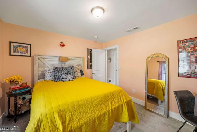 carpeted bedroom featuring baseboards and visible vents