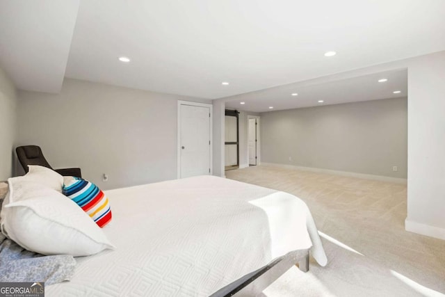 bedroom featuring baseboards, light colored carpet, and recessed lighting