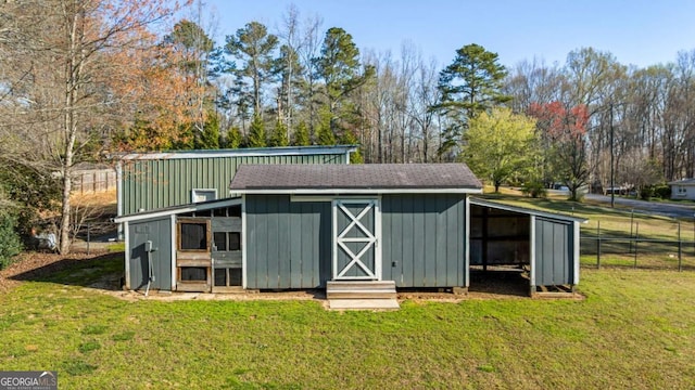 view of poultry coop with fence and a yard