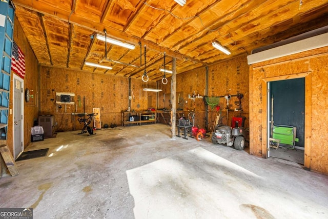 garage with a workshop area