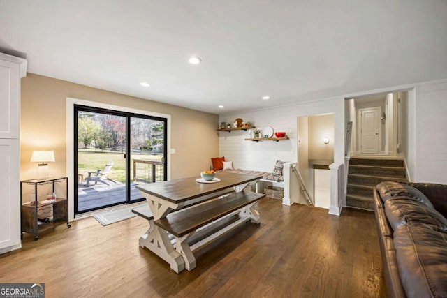 dining area with stairs, wood finished floors, and recessed lighting