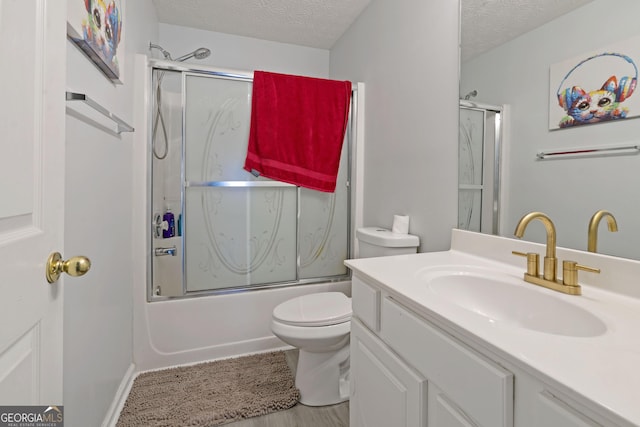 85 Clairidge Ln, Lawrenceville, GA 30046 - full bath with toilet, vanity, enclosed tub / shower combo, and a textured ceiling