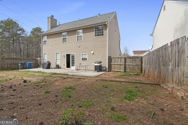 85 Clairidge Ln, Lawrenceville, GA 30046 - back of house featuring a patio, a chimney, and a fenced backyard