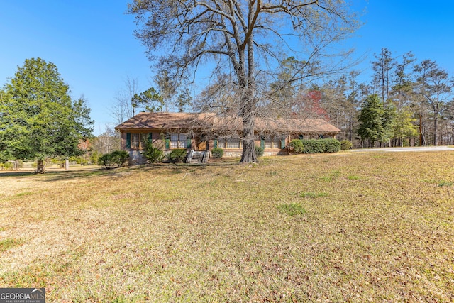 9095 Cedar Grove Rd, Fairburn, GA 30213 - view of front of house with a front yard